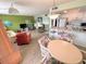 Dining area with round table and chairs, open to kitchen at 5434 Chad Pl # 20, New Port Richey, FL 34652