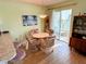 Bright dining area with round table and four chairs at 5434 Chad Pl # 20, New Port Richey, FL 34652