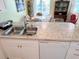Kitchen boasts granite countertops, a double sink, and a dishwasher at 5434 Chad Pl # 20, New Port Richey, FL 34652