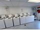 On-site laundry facility with multiple washer and dryer units at 5434 Chad Pl # 20, New Port Richey, FL 34652