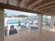 Relaxing pool area with tables and chairs under covered patio at 5434 Chad Pl # 20, New Port Richey, FL 34652