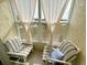 Relaxing sunroom with comfy chairs and scenic water views at 5434 Chad Pl # 20, New Port Richey, FL 34652