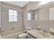 Clean bathroom with a bathtub, toilet, and updated vanity at 6033 Wilds Dr # B07, New Port Richey, FL 34653
