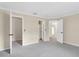 Bright bedroom with neutral walls, carpeting, and access to bathroom and closet at 6033 Wilds Dr # B07, New Port Richey, FL 34653