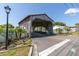 Quaint community entrance with a charming wooden bridge at 6033 Wilds Dr # B07, New Port Richey, FL 34653
