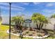 Landscaped entrance to The Wilds community featuring a sign and palm trees at 6033 Wilds Dr # 6033, New Port Richey, FL 34653