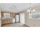 Eat-in kitchen with wood cabinets and sliding glass doors at 6033 Wilds Dr # B07, New Port Richey, FL 34653