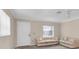 Living room with neutral walls, white door, and plush sofas at 6033 Wilds Dr # B07, New Port Richey, FL 34653