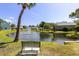 Serene pond with fountain and bench in community at 6033 Wilds Dr # B07, New Port Richey, FL 34653