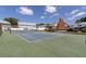 Community tennis court with green surface at 6033 Wilds Dr # B07, New Port Richey, FL 34653