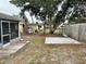 Backyard with a patio and wooden fence at 7207 Nova Scotia Dr, Port Richey, FL 34668
