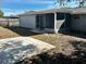 Spacious backyard patio with screened enclosure and a large yard at 7207 Nova Scotia Dr, Port Richey, FL 34668
