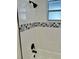 Updated bathroom with black accents and patterned tile at 7207 Nova Scotia Dr, Port Richey, FL 34668