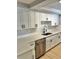 Modern kitchen featuring white shaker cabinets,quartz countertops, and stainless steel appliances at 7207 Nova Scotia Dr, Port Richey, FL 34668