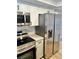 Modern kitchen with stainless steel appliances and white cabinets at 7207 Nova Scotia Dr, Port Richey, FL 34668