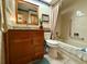 Updated bathroom with granite vanity and bathtub at 8111 Merrimac Dr, Port Richey, FL 34668