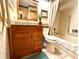 Updated bathroom with granite vanity and bathtub at 8111 Merrimac Dr, Port Richey, FL 34668