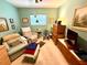 Comfortable bedroom with light teal walls and ample space for relaxation at 8111 Merrimac Dr, Port Richey, FL 34668