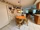 Cozy kitchen nook with a round wooden table and four chairs at 8111 Merrimac Dr, Port Richey, FL 34668