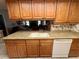 Kitchen featuring granite countertops and ample cabinetry at 8111 Merrimac Dr, Port Richey, FL 34668