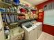 Laundry room with washer, dryer, utility sink, and shelving at 8111 Merrimac Dr, Port Richey, FL 34668