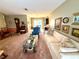 Open living room with views into dining area at 8111 Merrimac Dr, Port Richey, FL 34668