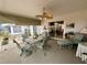 Relaxing screened porch with seating and ceiling fan at 8111 Merrimac Dr, Port Richey, FL 34668