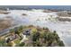 Aerial view of waterfront home, showcasing property and surrounding landscape at 8446 Braganza St, Spring Hill, FL 34608