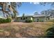 Expansive backyard with lush greenery and a large yard at 8446 Braganza St, Spring Hill, FL 34608