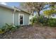 Landscaped backyard with mature trees and a storage shed at 8446 Braganza St, Spring Hill, FL 34608