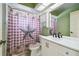Bathroom with white vanity and shower/tub combo at 8446 Braganza St, Spring Hill, FL 34608