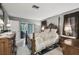 Bright bedroom featuring a comfortable bed and access to a patio at 8446 Braganza St, Spring Hill, FL 34608