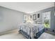 Bedroom with a white metal bed frame and blue bedding at 8446 Braganza St, Spring Hill, FL 34608