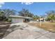 Ranch style home with a two car garage and mature landscaping at 8446 Braganza St, Spring Hill, FL 34608