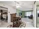 Kitchen with breakfast bar, stainless steel appliances, and view of bedroom at 8446 Braganza St, Spring Hill, FL 34608