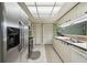 Clean kitchen with stainless steel refrigerator and dishwasher at 8446 Braganza St, Spring Hill, FL 34608