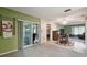 Open living space with access to the kitchen and patio at 8446 Braganza St, Spring Hill, FL 34608