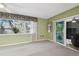 Living area featuring a sliding door to outdoor space at 8446 Braganza St, Spring Hill, FL 34608