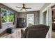 Relaxing sunroom with a comfortable chair and TV at 8446 Braganza St, Spring Hill, FL 34608