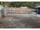 Empty lot backyard with wooden fence at 8703 Robilina Rd, Port Richey, FL 34668