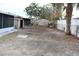 Large backyard with mature trees and shed at 8703 Robilina Rd, Port Richey, FL 34668