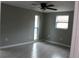 Spacious bedroom with tile floors and multiple windows at 8703 Robilina Rd, Port Richey, FL 34668