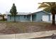 Newly renovated single story home with attached garage and palm tree at 8703 Robilina Rd, Port Richey, FL 34668