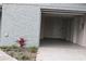 Newly renovated garage with white door and grey floor at 8703 Robilina Rd, Port Richey, FL 34668