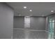 Spacious living area with grey walls and tile floors at 8703 Robilina Rd, Port Richey, FL 34668