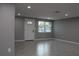 Bright living room with grey walls and tile floors at 8703 Robilina Rd, Port Richey, FL 34668