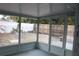 Spacious screened porch overlooking backyard at 8703 Robilina Rd, Port Richey, FL 34668