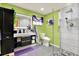 Stylish bathroom with lime green walls and modern fixtures at 8809 Shoemaker Ln, Hudson, FL 34667