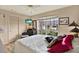 Cozy bedroom with a king-size bed and updated flooring at 8809 Shoemaker Ln, Hudson, FL 34667