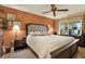 Comfortable bedroom with a king-size bed and an ensuite bathroom at 8809 Shoemaker Ln, Hudson, FL 34667